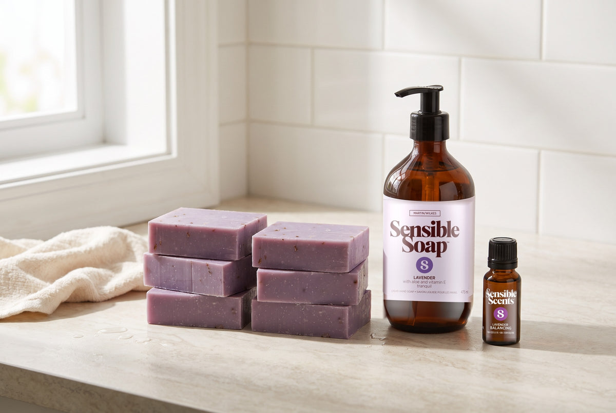 A Sensible Lavender six-pack of bar soap, Lavender liquid hand soap and Lavender essential oil on a bathroom counter